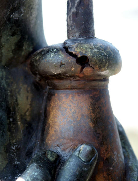 Stress corrosion crack in a bronze monument caused by build-up of rust around a decorative steel rod. (Courtesy Kingston Technical Software)
