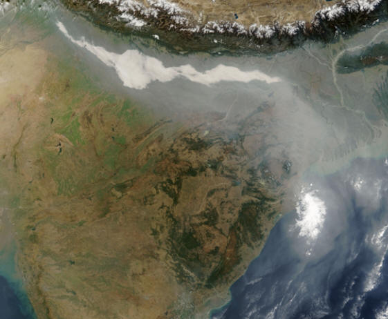 Haze and fog stretched over northern India on December 17, 2004, and mixed with a river of haze that flowed west and south across Bangladesh and over the Bay of Bengal. (Courtesy NASA)