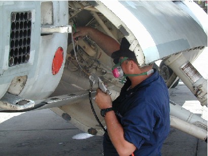 Fogging an aircraft port wheel well